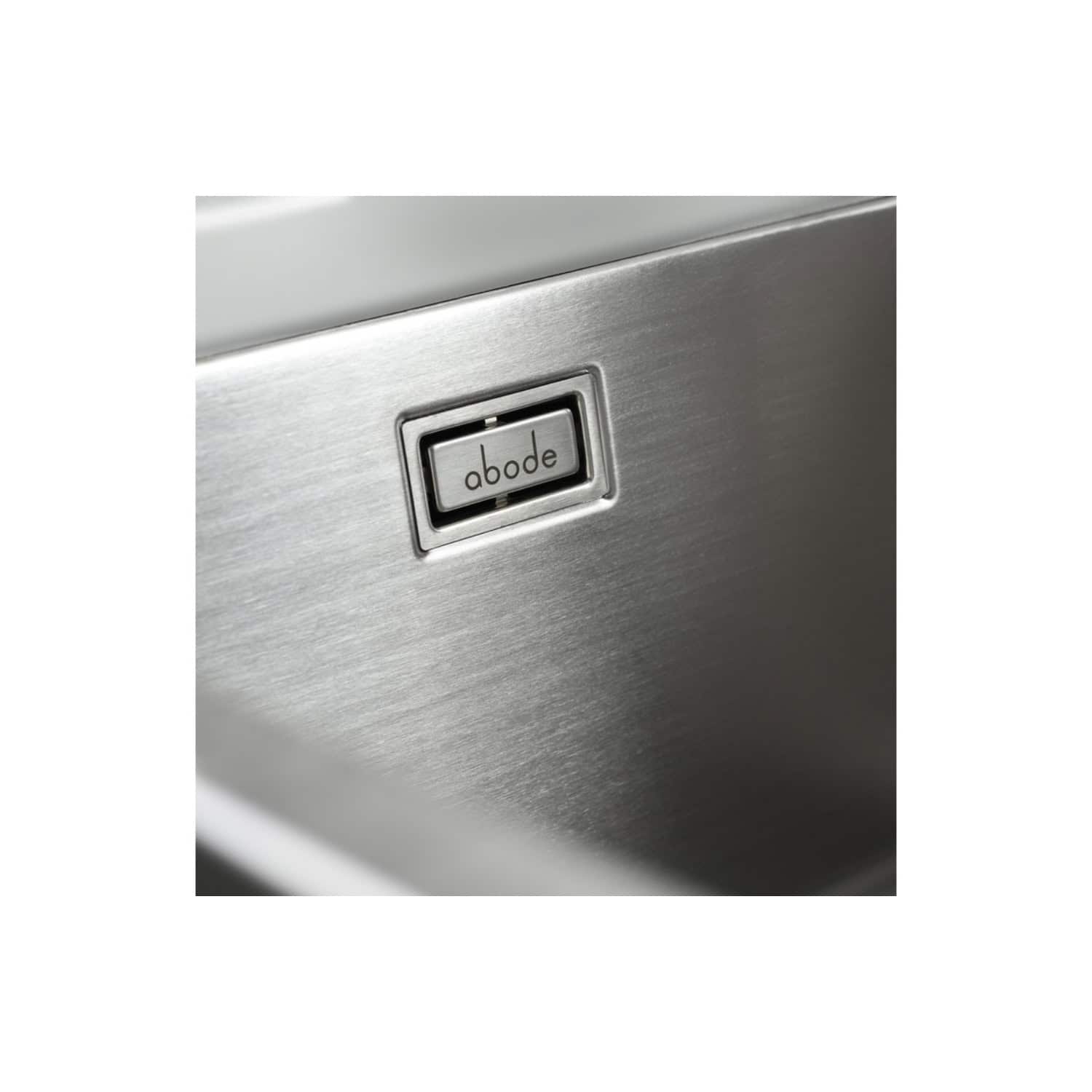 Stainless steel bathroom / kitchen appliance control panel with the brand name "abode" on the button, modern and sleek design.