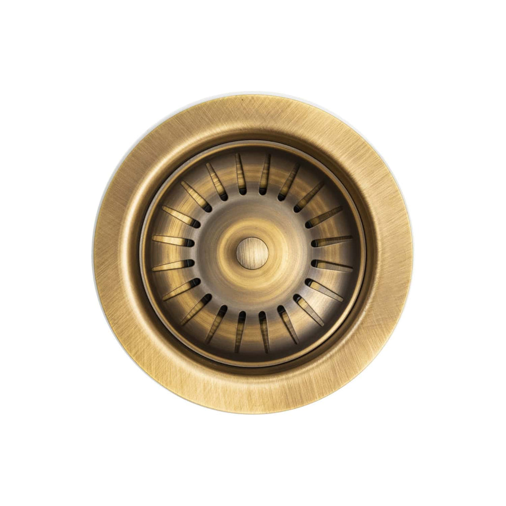 Shower drain with brass finish, designed for modern bathroom plumbing. Durable and stylish gold-coloured drain cover suitable for various bathroom sink and shower installations.