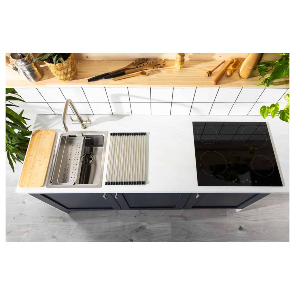 Modern compact kitchen with stainless steel sink, black induction hob, and stylish navy cabinets, featuring minimalist countertop and natural wood accents, perfect for contemporary home kitchens.