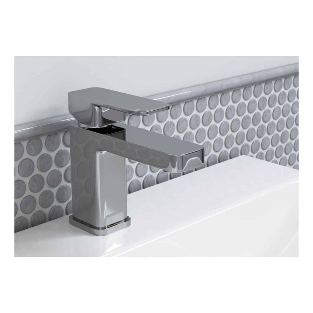 Sleek modern chrome bathroom tap mounted on a white sink with grey textured circular tile backsplash. Perfect for contemporary bathroom designs focusing on style and functionality.