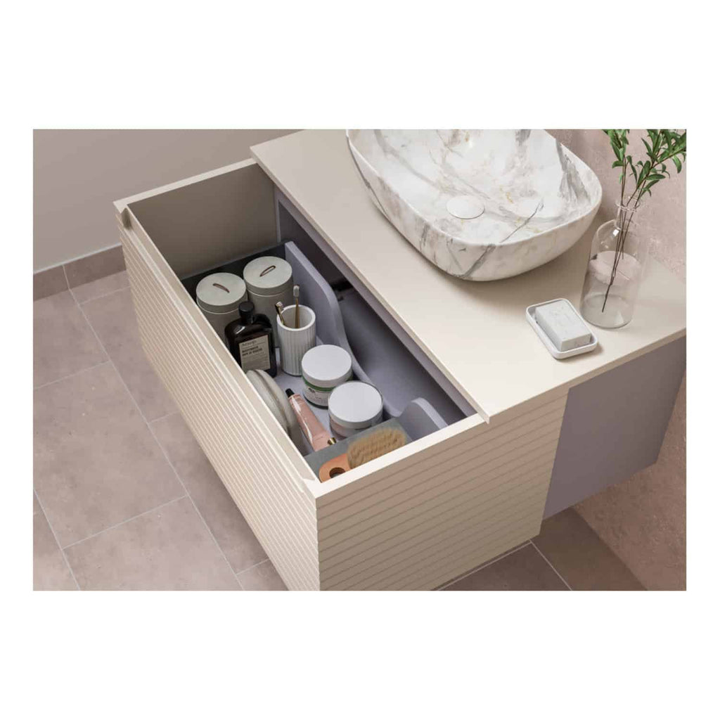 Organised bathroom drawer with toiletries and skincare products, modern bathroom vanity with marble sink, minimalistic decor, and stylish bathroom furniture for a sleek look.