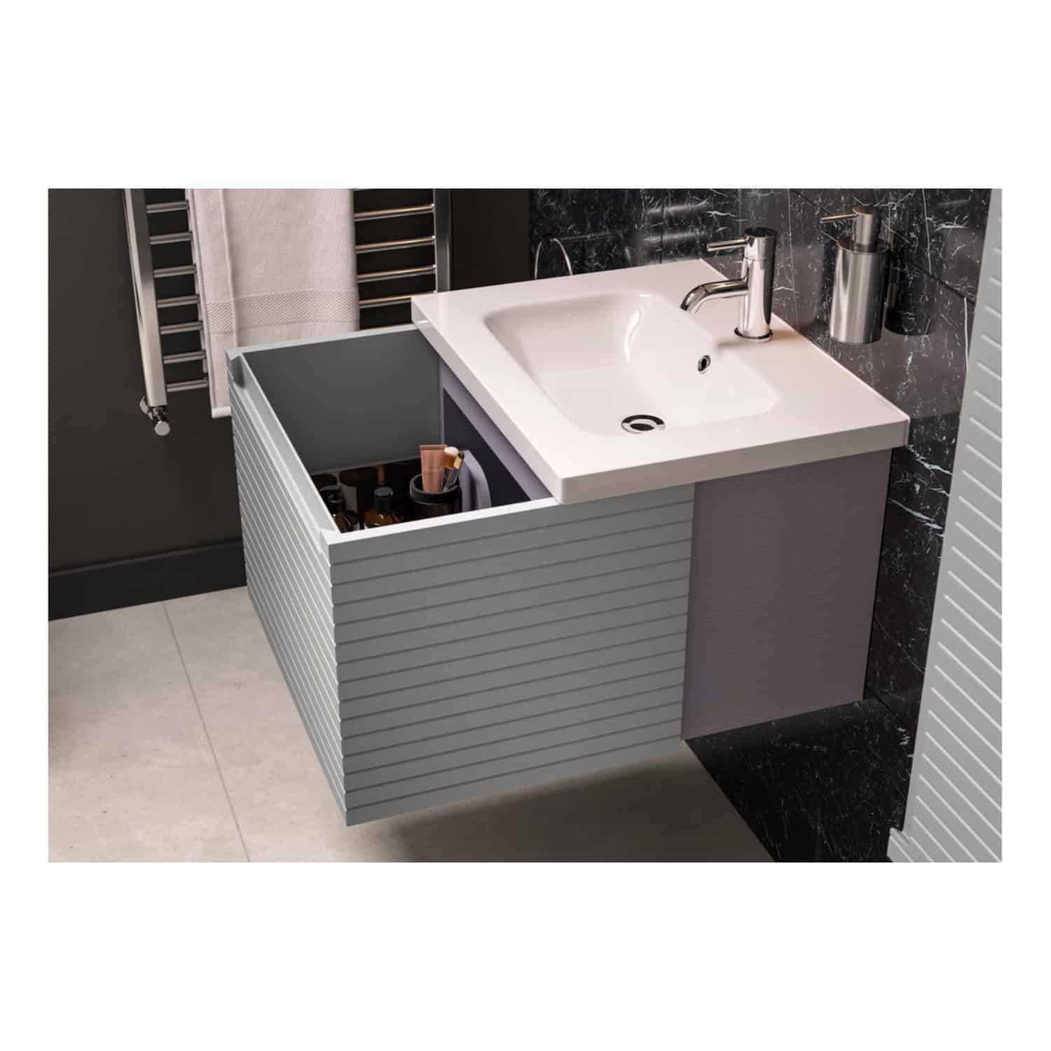 Modern bathroom sink with under-storage cabinet, chrome faucet, black marble wall, stainless steel soap dispenser, and heated towel rail, showcasing sleek and contemporary bathroom design.