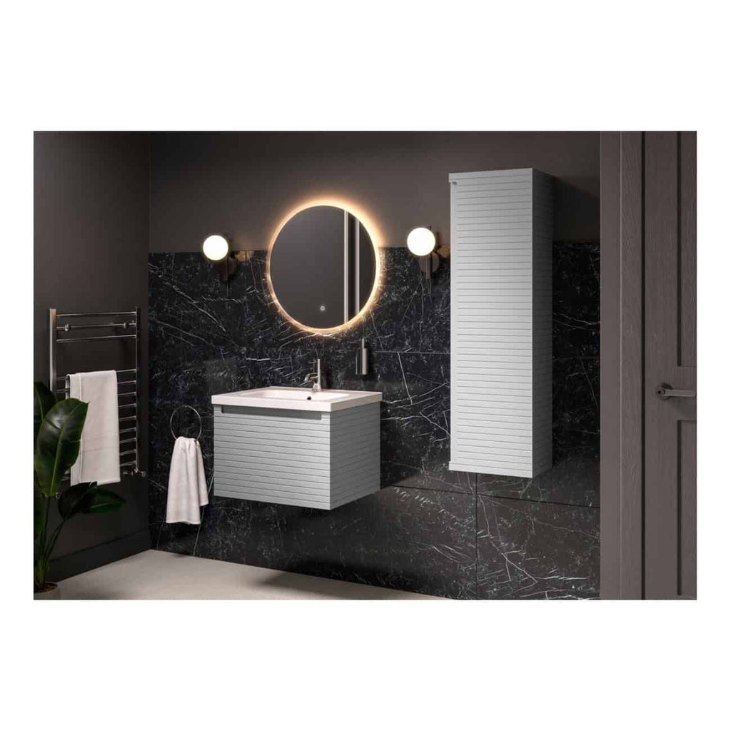 Sleek modern bathroom with black marble walls, illuminated round mirror, white vanity unit, wall-mounted storage, and elegant lighting fixtures, showcasing luxurious bathroom design ideas.