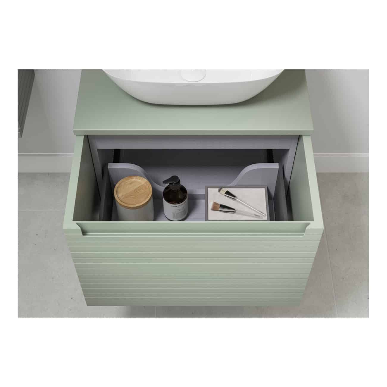 Stylish bathroom vanity with open storage drawer containing soap dispenser, brush, and skincare products, designed for modern bathroom organisation and decor.