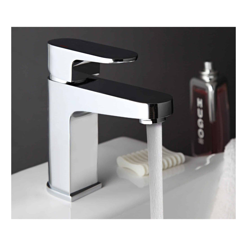 Elegant modern bathroom mixer tap with chrome finish and black handle, water flowing into a white sink, showcasing stylish bathroom fixtures by Bubly Bathrooms.