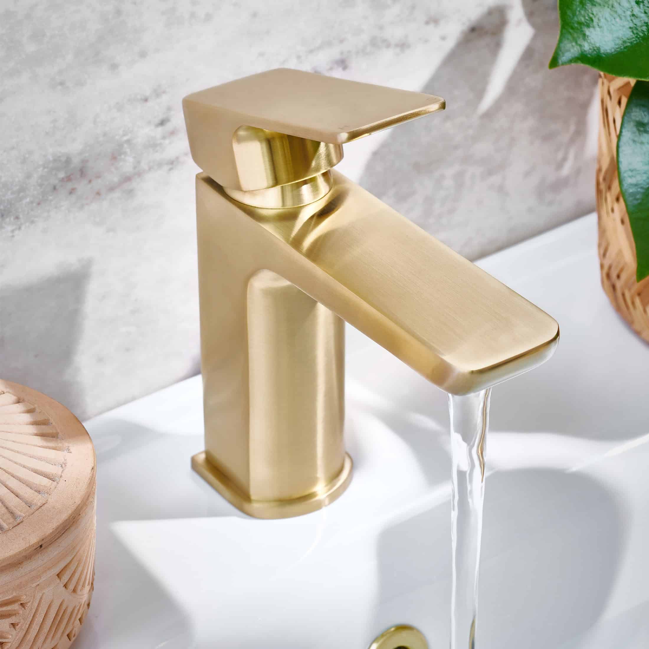 Luxury gold bathroom tap with water flowing, modern and stylish fixtures for contemporary bathroom design, focus on high-quality craftsmanship and elegant aesthetics.