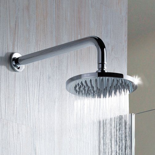 Showerhead with water flowing, modern bathroom fixture by Bubly Bathrooms, chrome finish, mounted on tiled wall, premium quality, space-saving design.