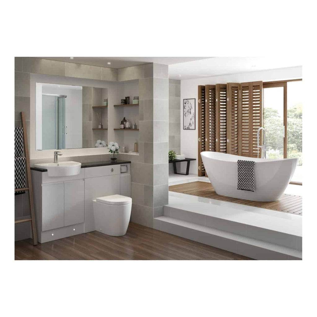 Contemporary bathroom with freestanding bathtub, modern vanity, large mirror, wooden flooring, and natural light; perfect for luxury bathroom renovation and stylish bathroom designs.