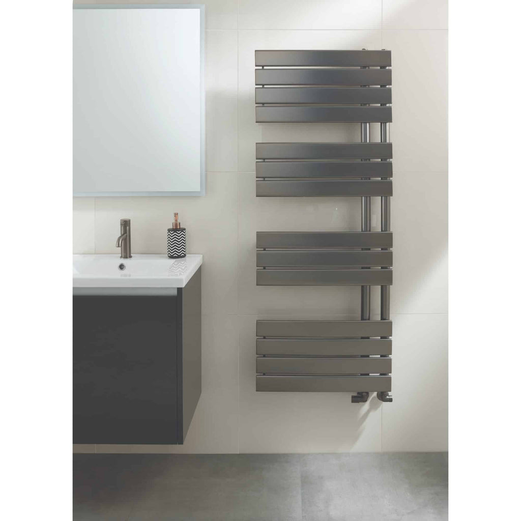 Sleek grey modern towel radiator in a contemporary bathroom with white tiled walls and a grey vanity unit. Perfect for adding style and warmth to stylish bathroom interiors.