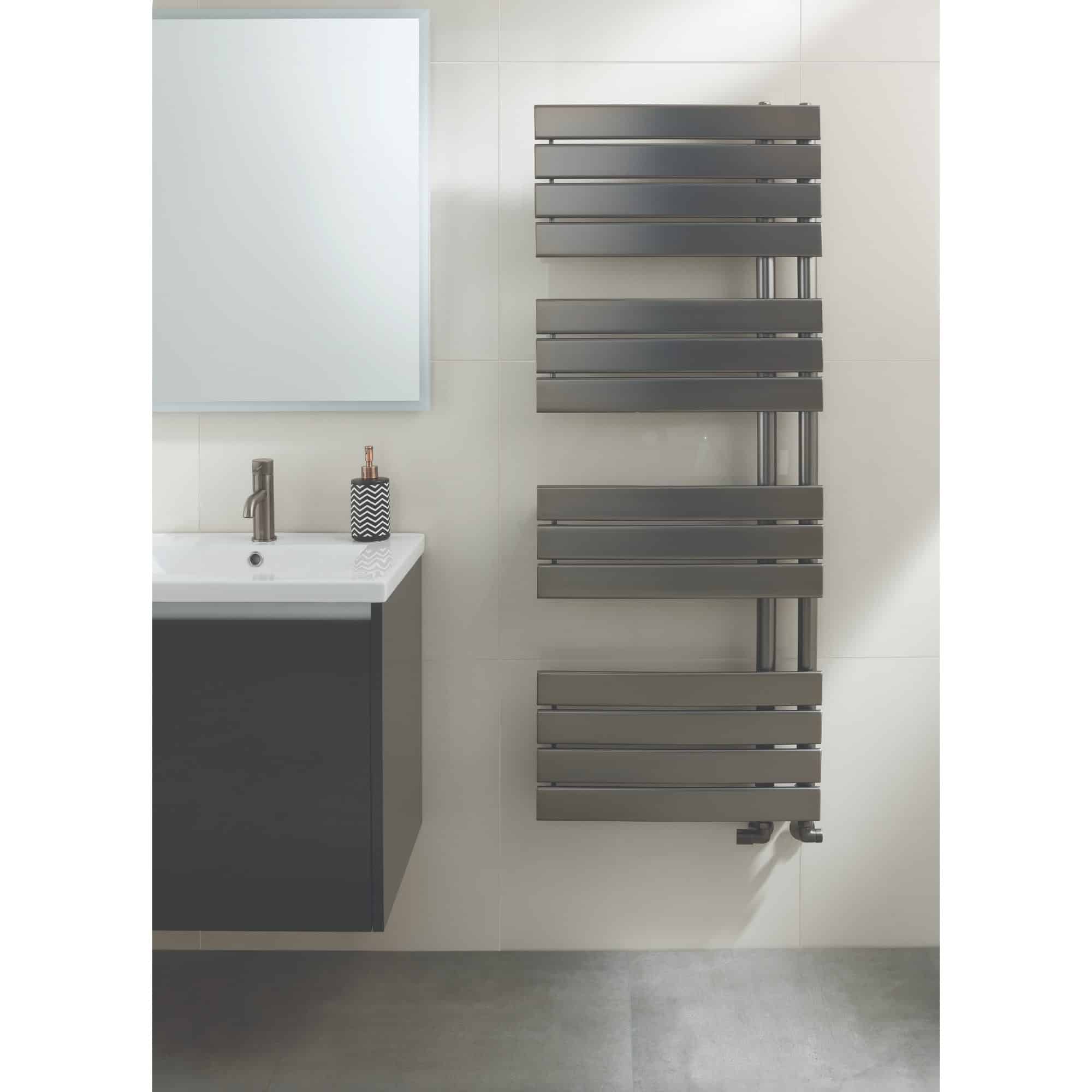 Sleek grey modern towel radiator in a contemporary bathroom with white tiled walls and a grey vanity unit. Perfect for adding style and warmth to stylish bathroom interiors.