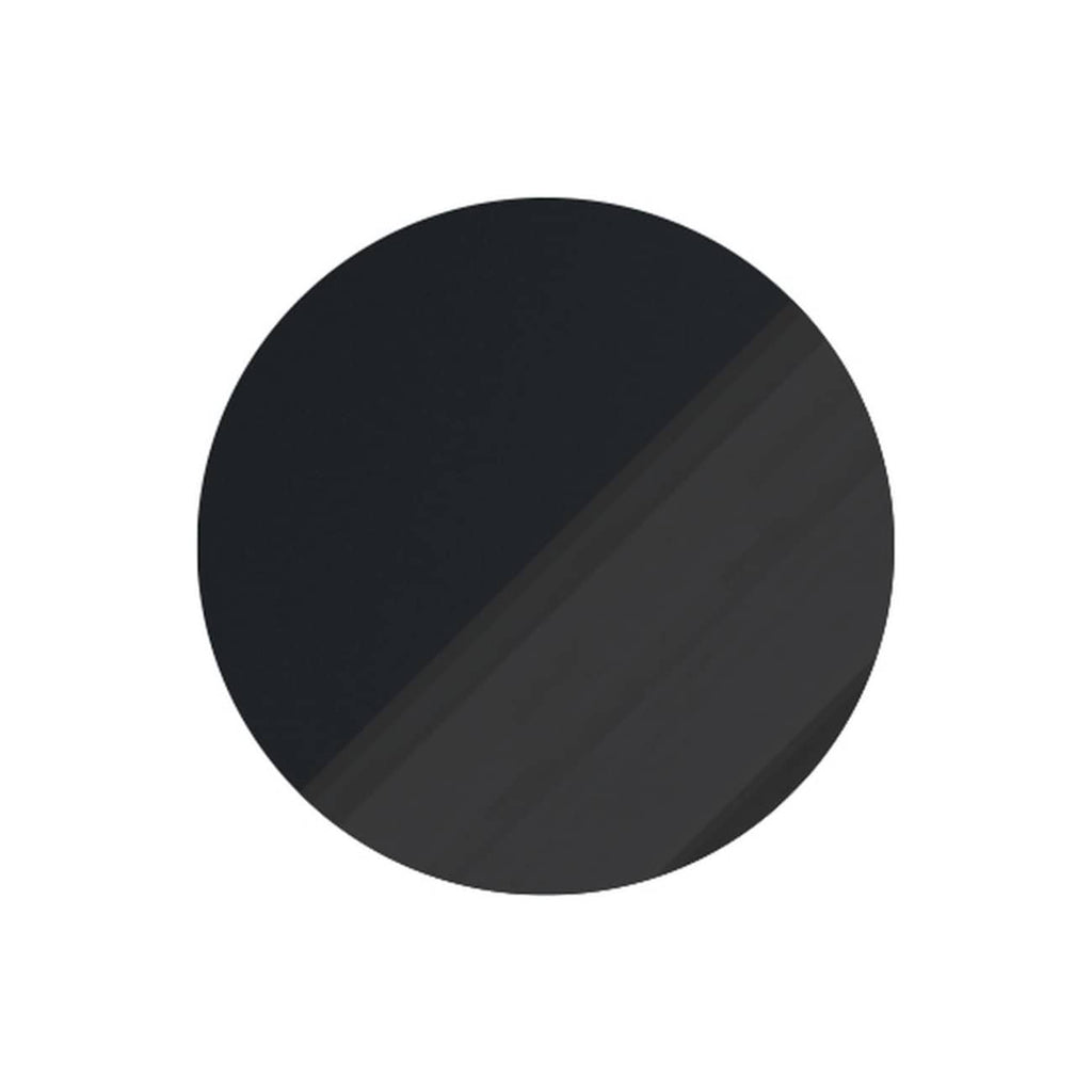 Black round button for bathroom fixtures or control panels.