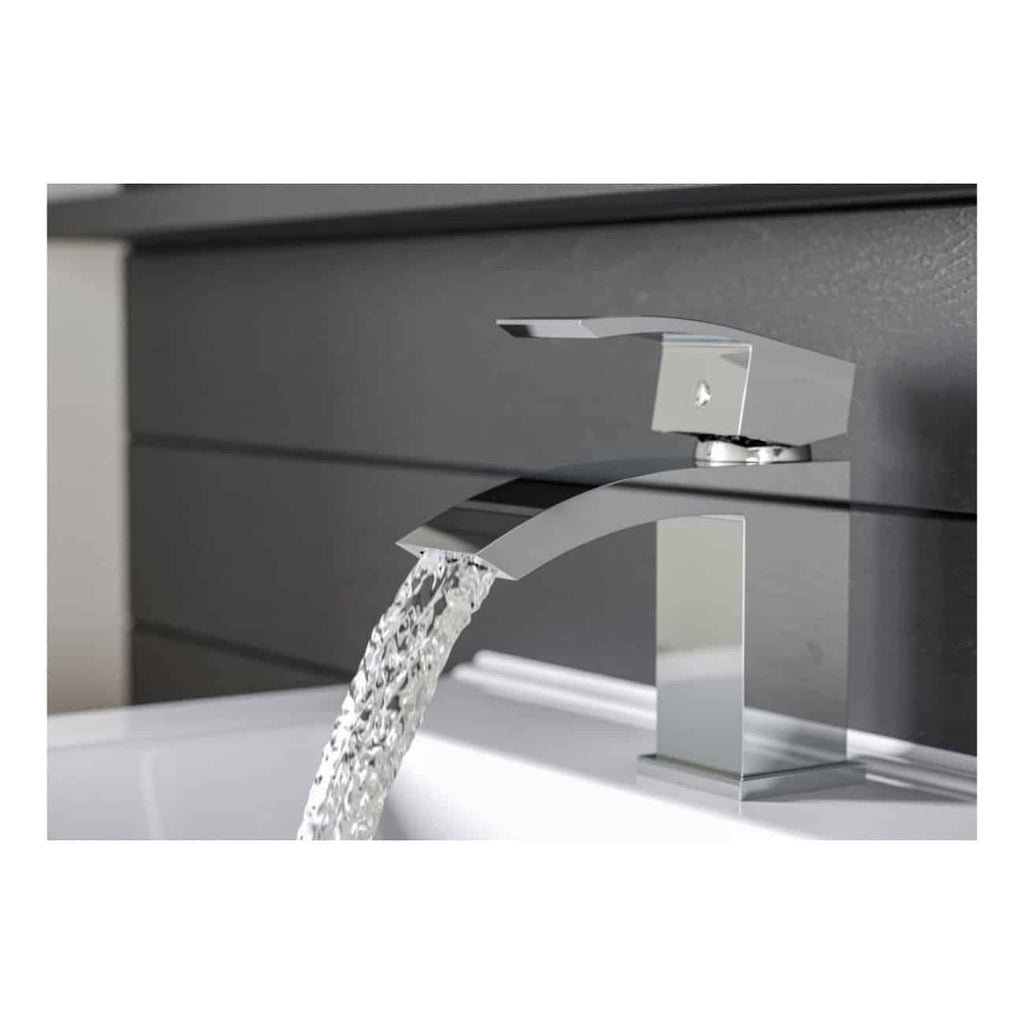 Sleek modern chrome bathroom faucet with water flowing into a white sink, designed for stylish and functional bathroom tapware.