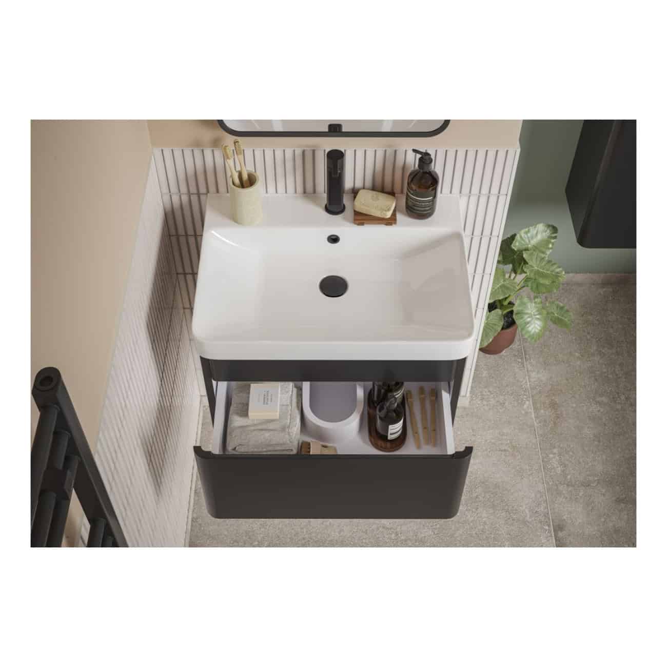 Sleek modern bathroom vanity with a white ceramic sink, black accents, and open storage featuring bathroom essentials; stylish and functional design for contemporary bathrooms.