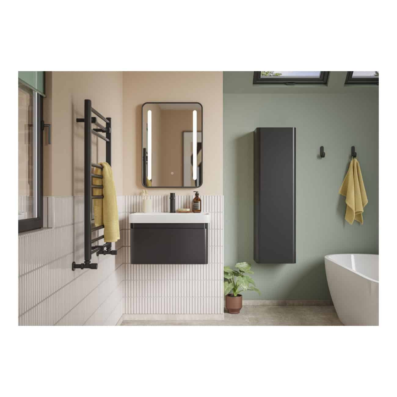 Bright modern bathroom featuring a black wall-mounted vanity, rectangular mirror with LED lighting, black radiator towel warmer, floating storage cabinet, and a freestanding white bathtub, with soft green walls and natural light.