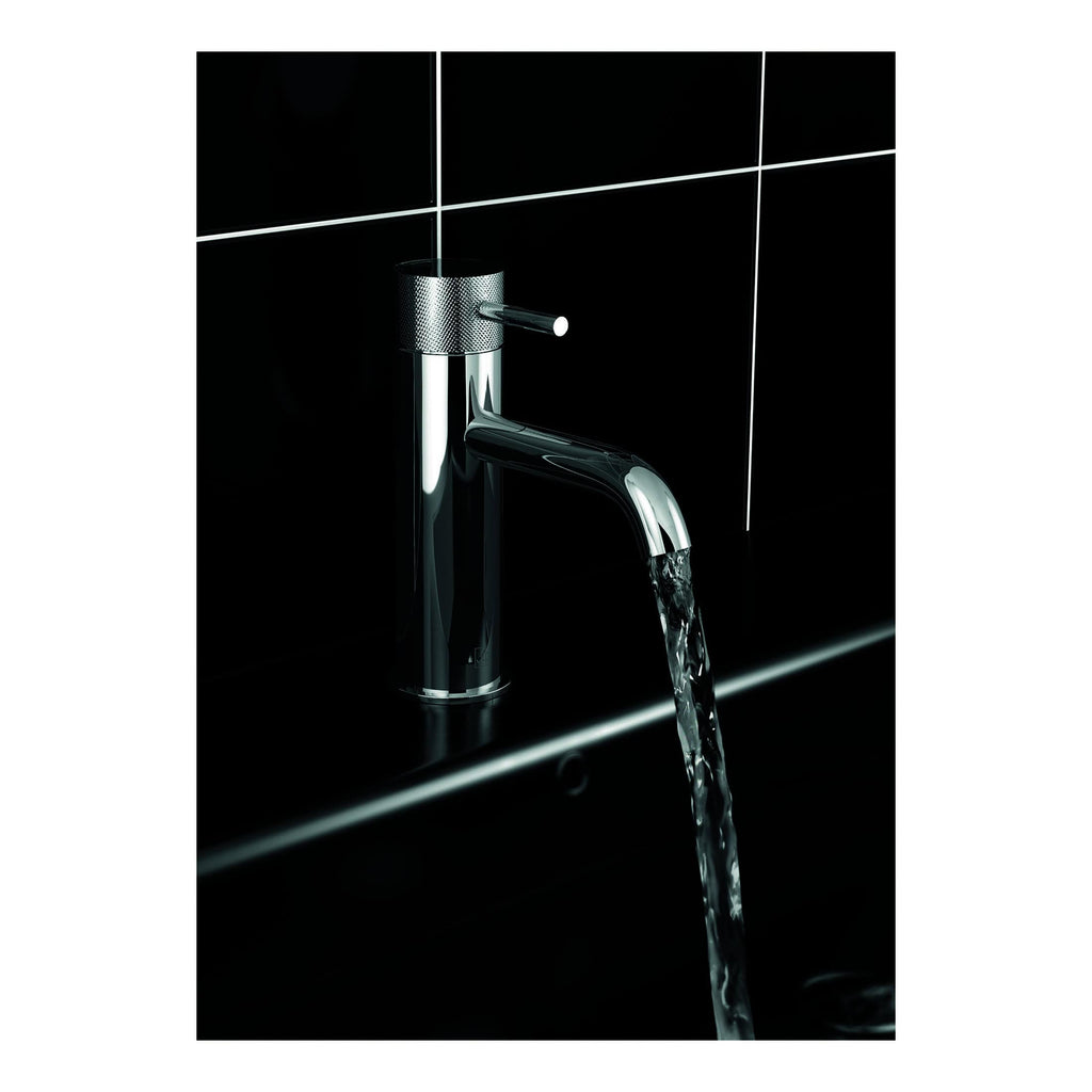 Shiny chrome bathroom tap with flowing water, modern design and black tiled background for luxury bathroom fixtures and fittings.