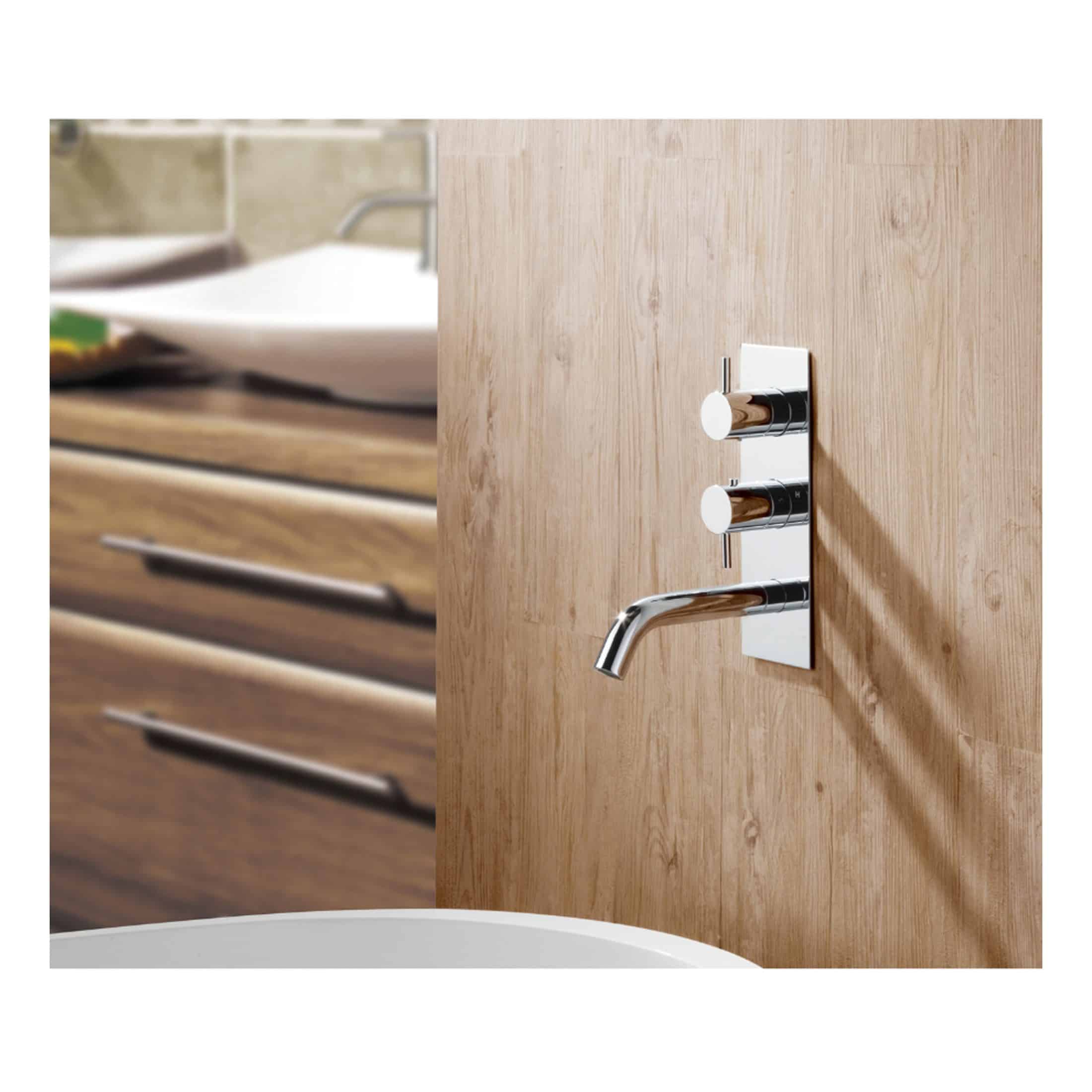 Sleek chrome bathroom tap with dual control knobs mounted on a wooden wall, modern bathroom design, in a contemporary bathroom setting.