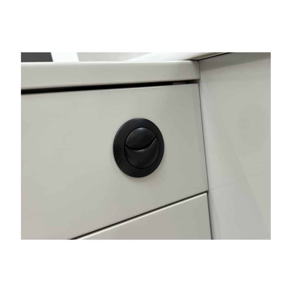 Locking cabinet door handle on white bathroom storage unit for secure bathroom organisation and modern bathroom furniture.