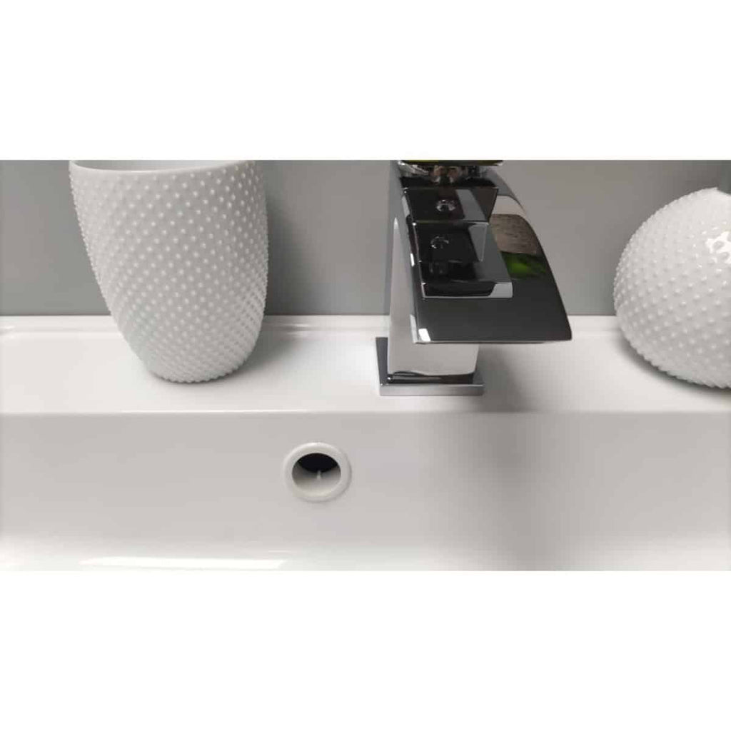 Elegant modern bathroom sink featuring a sleek chrome tap and decorative textured vases, showcasing stylish bathroom fixtures and accessories ideal for contemporary bathroom design.