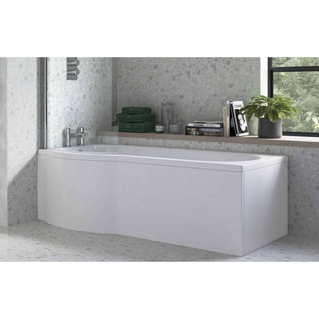 Bright white modern freestanding bathtub with chrome fixtures in stylish bathroom with terrazzo walls, grey window sill, and decorative accessories for contemporary bathroom design.