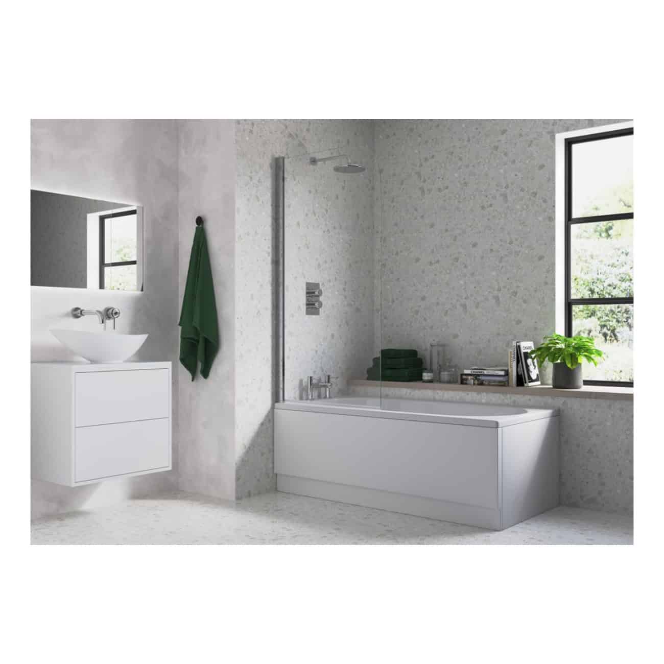 Sleek modern bathroom with white bathtub, green towel, large window with greenery view, minimalistic vanity, and decorative plants creating a fresh, contemporary bathroom design.