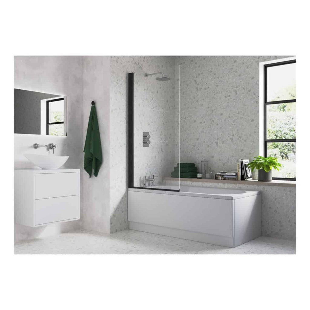 Sleek modern bathroom featuring a white bathtub with a glass screen, black-framed windows, green towels, and contemporary accessories in a bright, minimalist space.