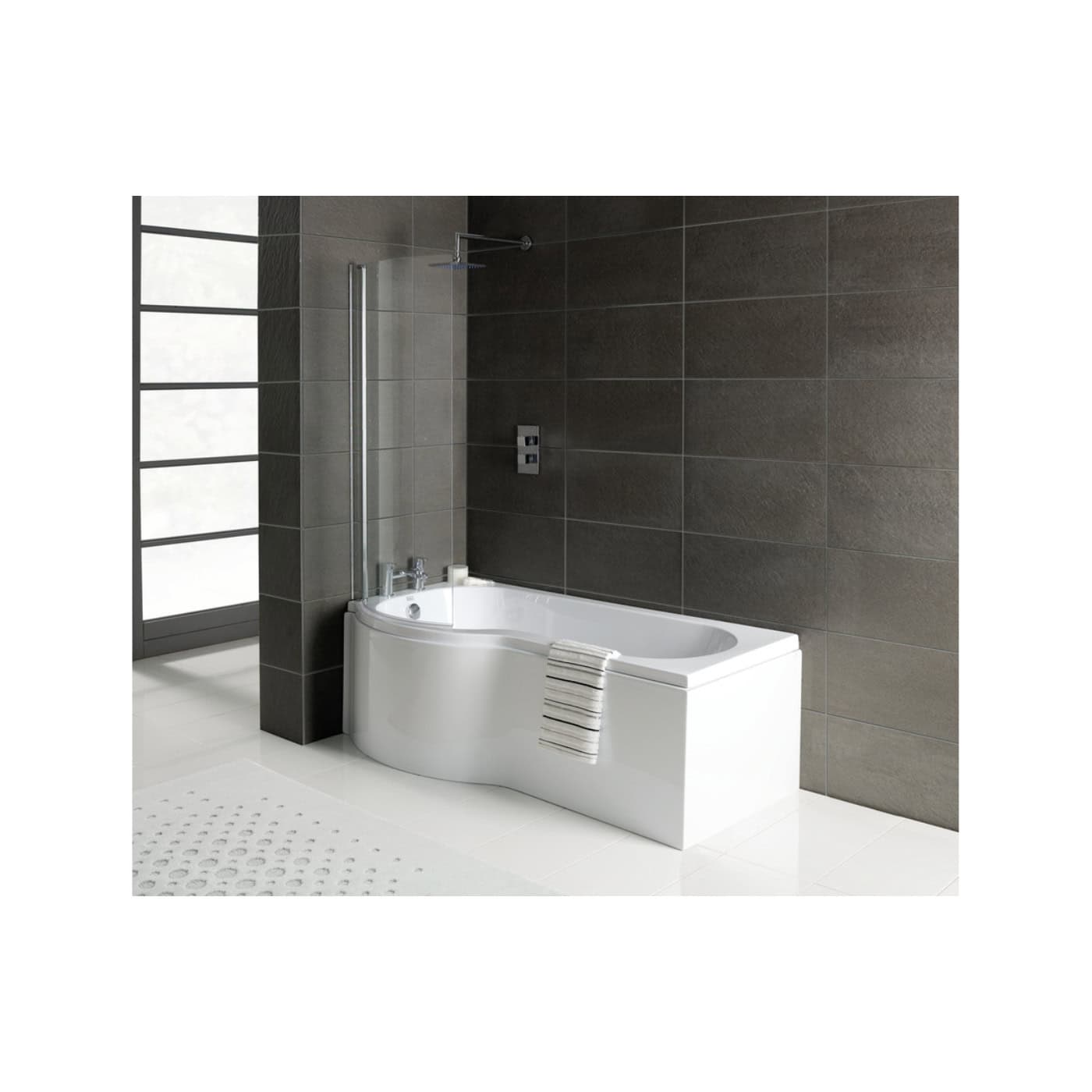 Sleek modern white bathtub with a curved design, fitted in a contemporary bathroom with dark wall tiles, chrome fixtures, and a glass shower screen for a luxurious bathroom remodel.