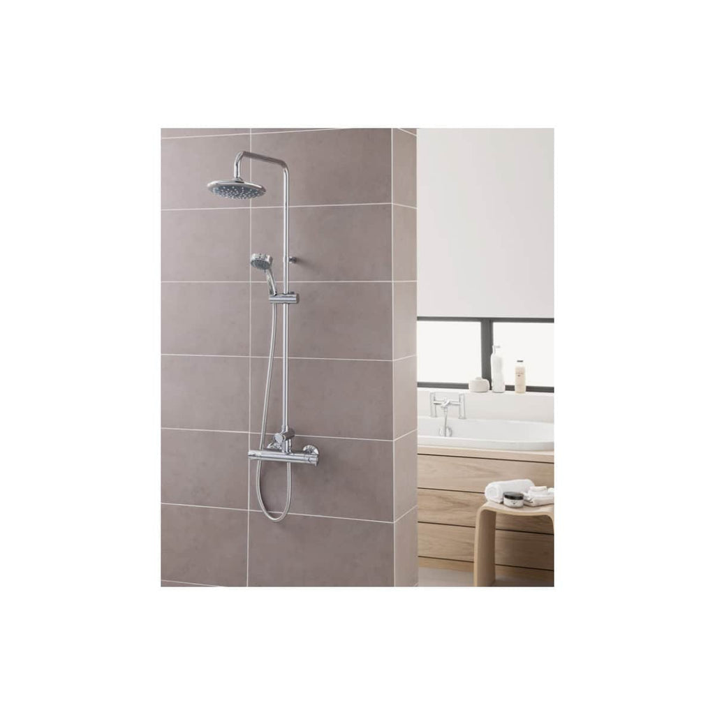 Chrome shower system with adjustable multi-function head in a modern bathroom setting.