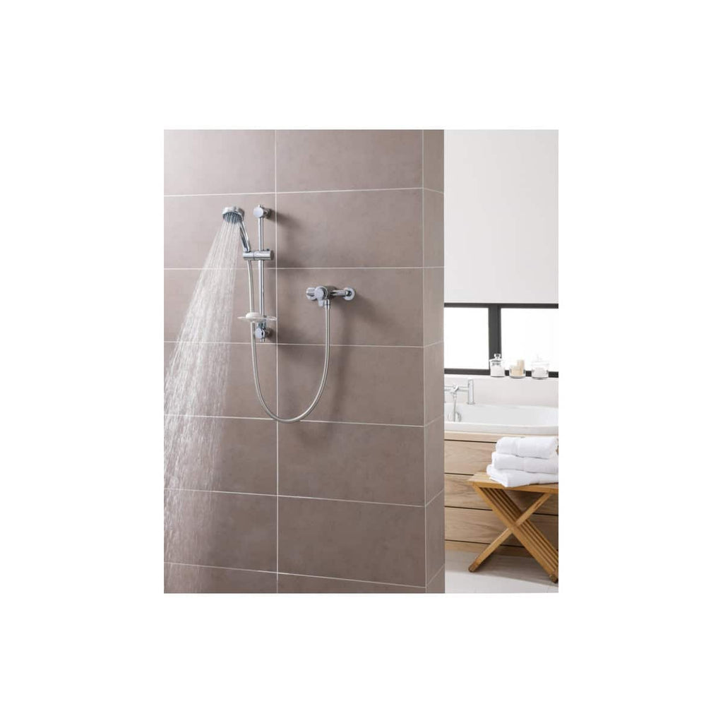Stylish showerhead and handheld shower in a modern bathroom with beige wall tiles, offering a sleek and contemporary bathroom shower solution.