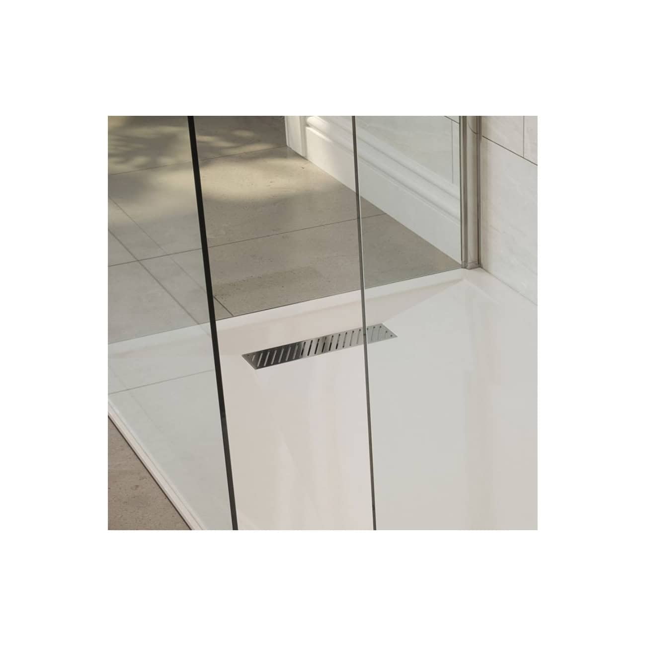 Shower drain installed on a modern tiled bathroom floor with glass shower enclosure, showcasing sleek bathroom design and high-quality fixtures.