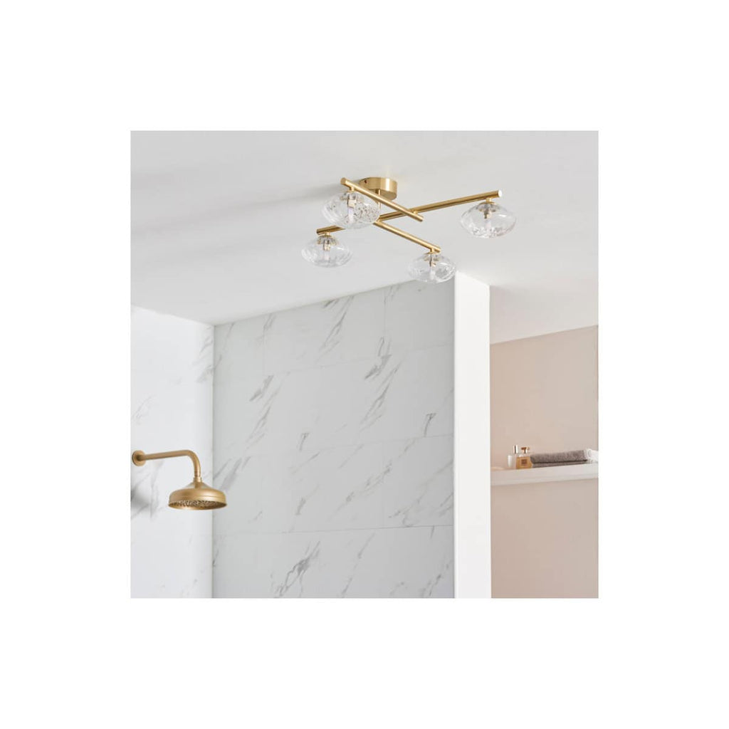Elegant modern ceiling light fixture with clear glass shades and gold fittings, perfect for contemporary bathroom lighting.