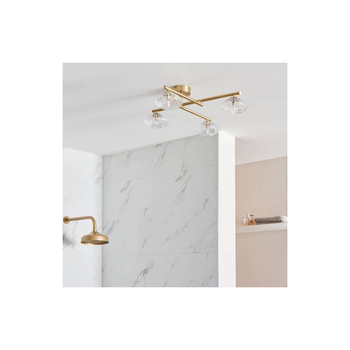 Elegant modern ceiling light fixture with clear glass shades and gold fittings, perfect for contemporary bathroom lighting.