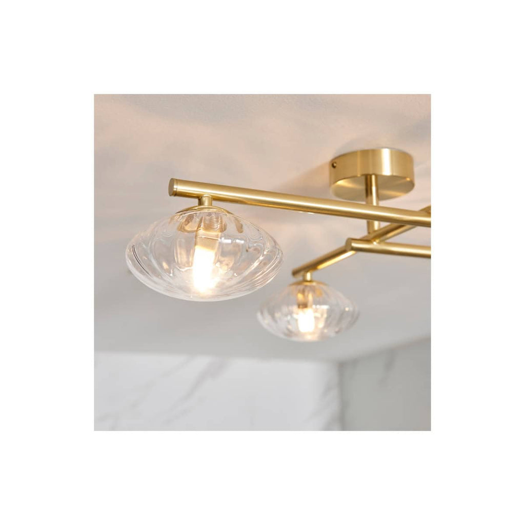 Elegant modern bathroom chandelier with brass finish and glass shades, perfect for enhancing bathroom lighting and décor. Designed by Bubly Bathrooms, combining style and functionality.