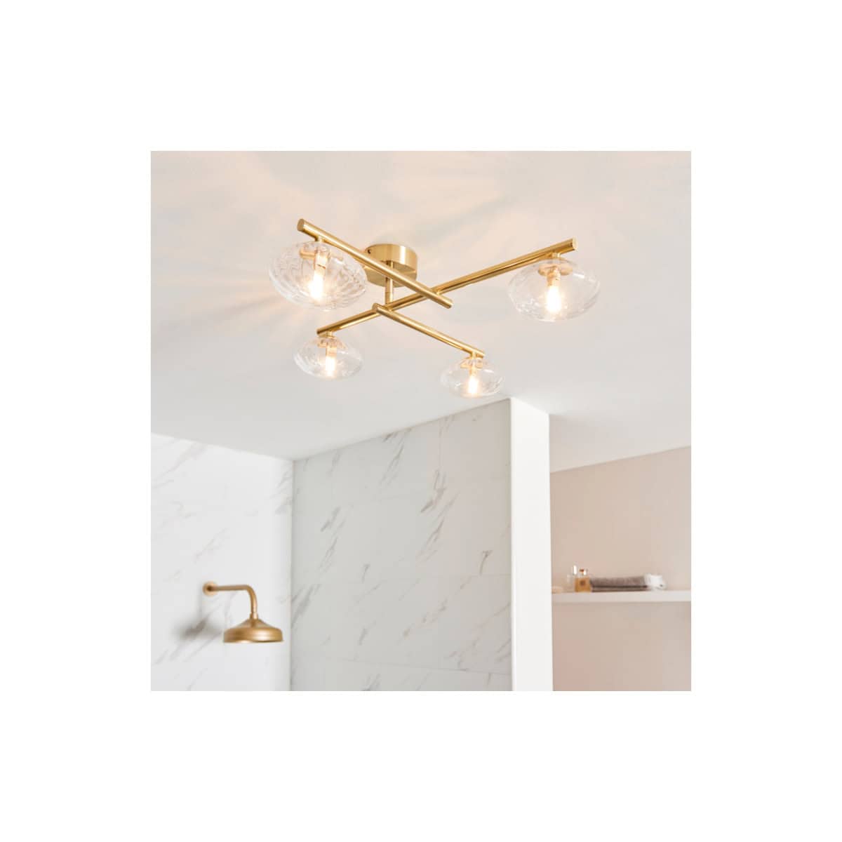 Modern gold ceiling light fixture with four glass shades, ideal for luxury bathroom lighting, enhancing contemporary bathroom decor and creating a stylish atmosphere.
