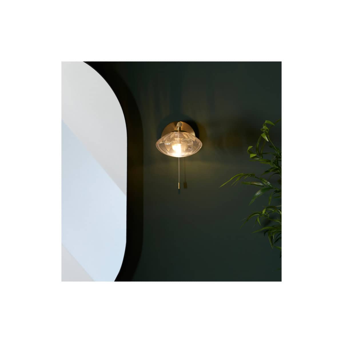 Elegant wall-mounted bathroom light with glass shade and pull cord, modern design for stylish bathroom lighting solutions.