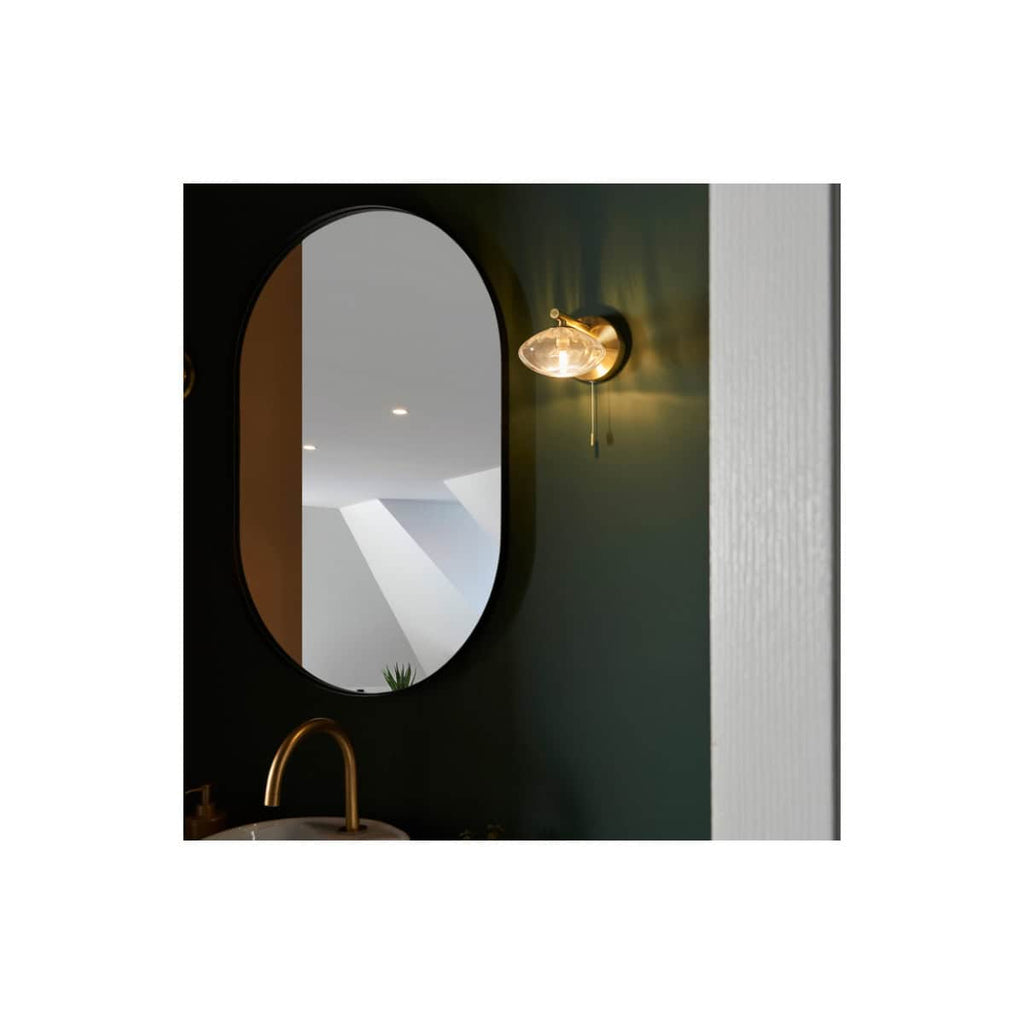 Sleek modern bathroom mirror with elegant lighting, gold fixtures, and stylish design, perfect for contemporary Bubly Bathrooms décor in the UK.
