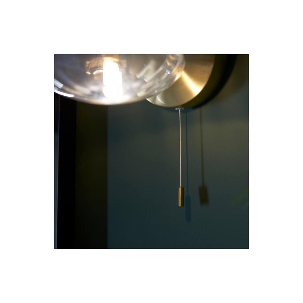 Sleek modern bathroom ceiling light with pull cord switch, designed for stylish and functional bathroom lighting solutions by Bubly Bathrooms.