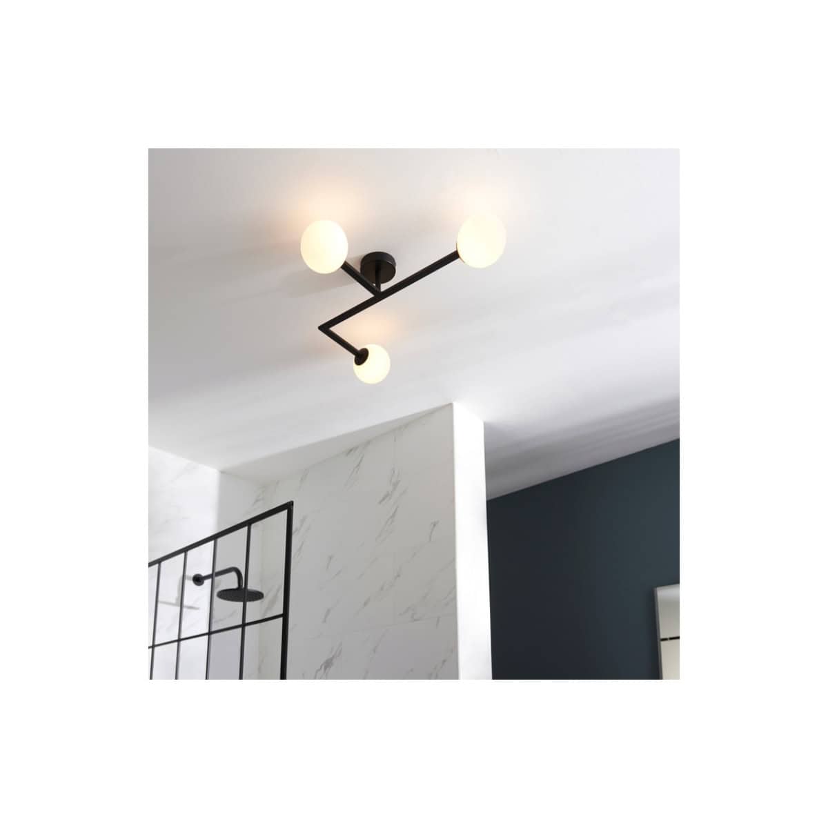 Modern black ceiling light fixture with three globe bulbs in a contemporary bathroom setting.
