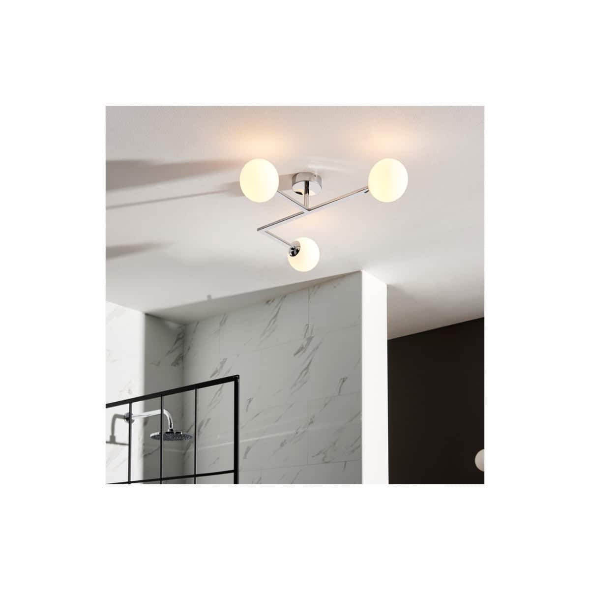 Contemporary ceiling light fixture with three round frosted glass globes and sleek chrome accents, perfect for modern bathroom lighting design.