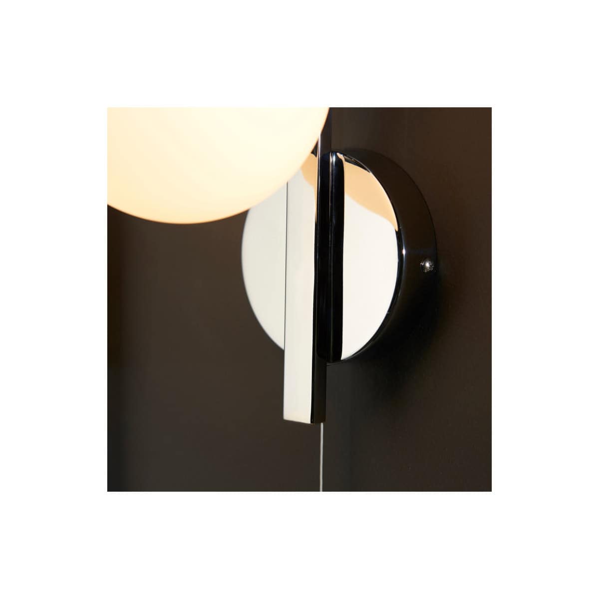 Sleek modern bathroom wall light fixture with a minimalist black and chrome finish, perfect for enhancing contemporary bathroom decor and lighting ambiance.
