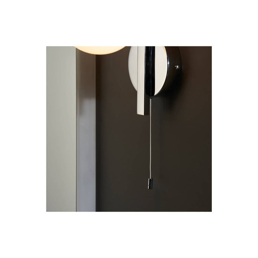 Sleek modern bathroom pull cord light switch with minimalist black and white design, perfect for contemporary bathroom decor. Easy-to-use pull cord adds convenience and style.