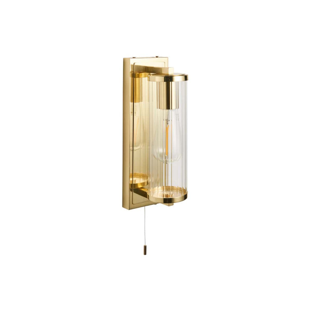 Sleek gold wall-mounted bathroom light with clear glass shade, modern design, ideal for contemporary bathrooms and vanity areas. Features a pull cord for easy control, perfect for stylish bathroom lighting.
