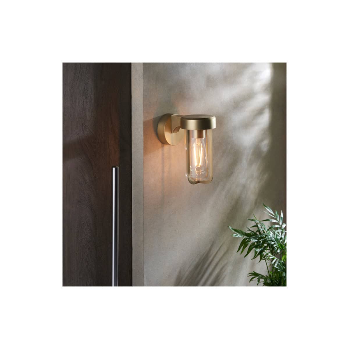Elegant wall-mounted bathroom light fixture with a glass shade, modern design, ideal for contemporary bathroom decor, adds ambient lighting and style to your space.