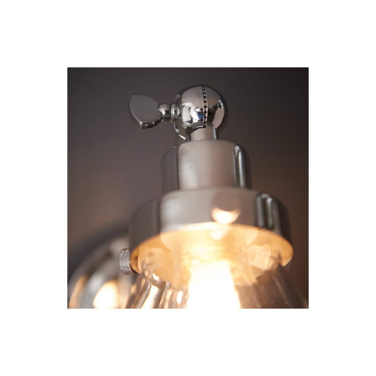 Shiny chrome bathroom ceiling light fixture with exposed light bulb, modern bathroom lighting, industrial style lighting, Bubly Bathrooms.