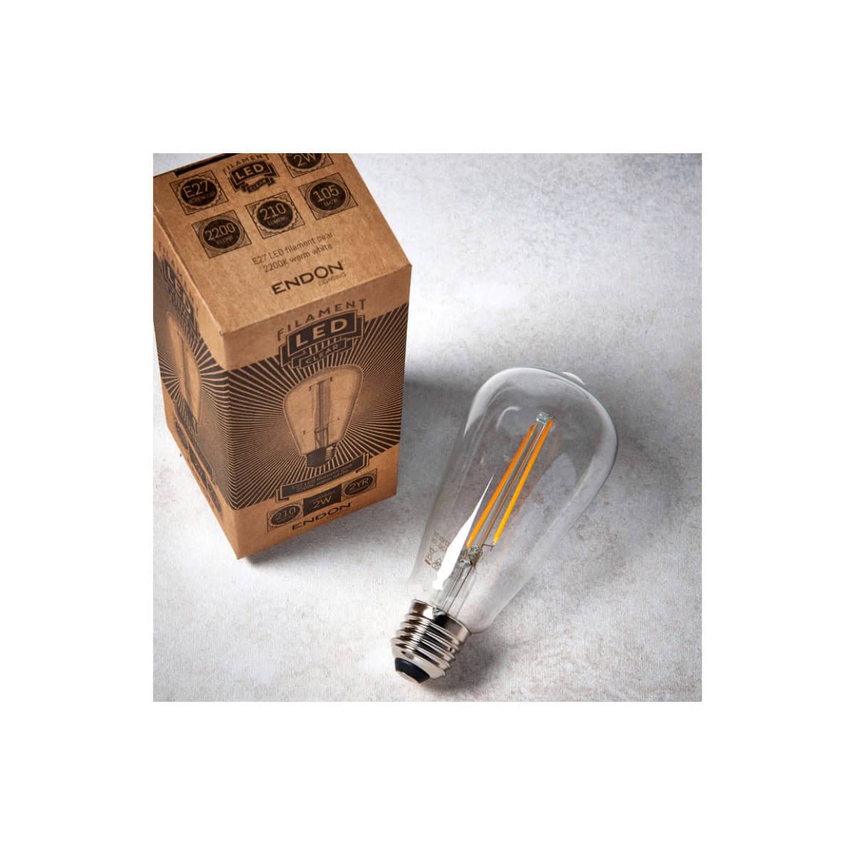 E27 LED filament light bulb with packaging, energy-efficient indoor lighting for modern bathrooms and homes. Perfect for stylish, eco-friendly illumination.