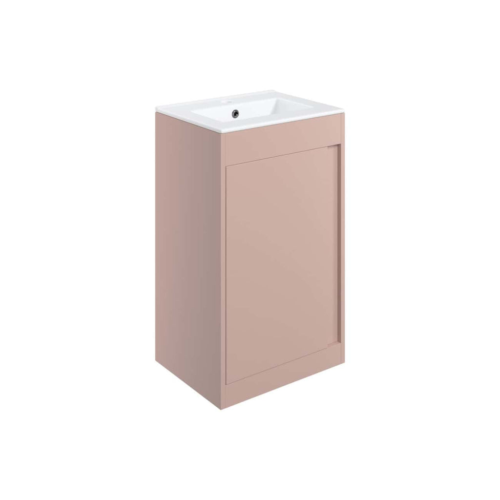 Sleek blush pink bathroom vanity unit with integrated sink, perfect for modern bathroom interiors. Features clean lines and ample storage, ideal for stylish and functional bathroom design.