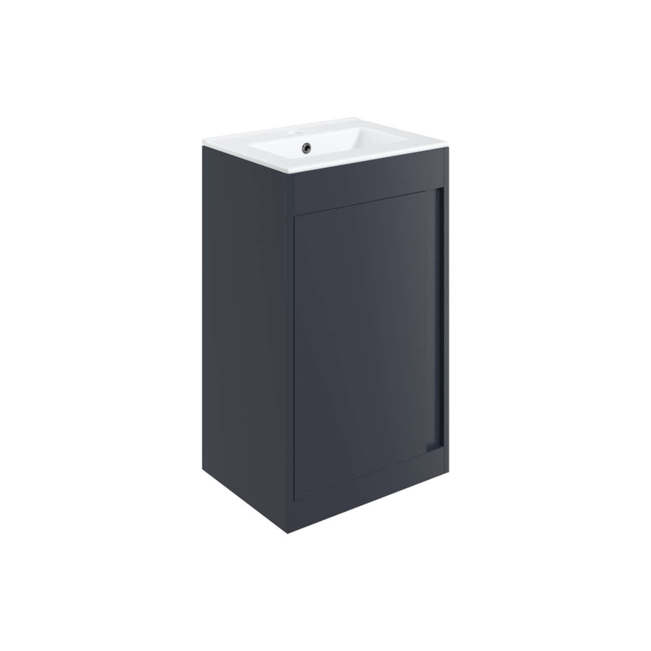 Sleek black bathroom vanity with integrated sink and storage cabinet, perfect for modern bathroom designs. Durable and stylish, ideal for contemporary wet room setups and bathroom decor.