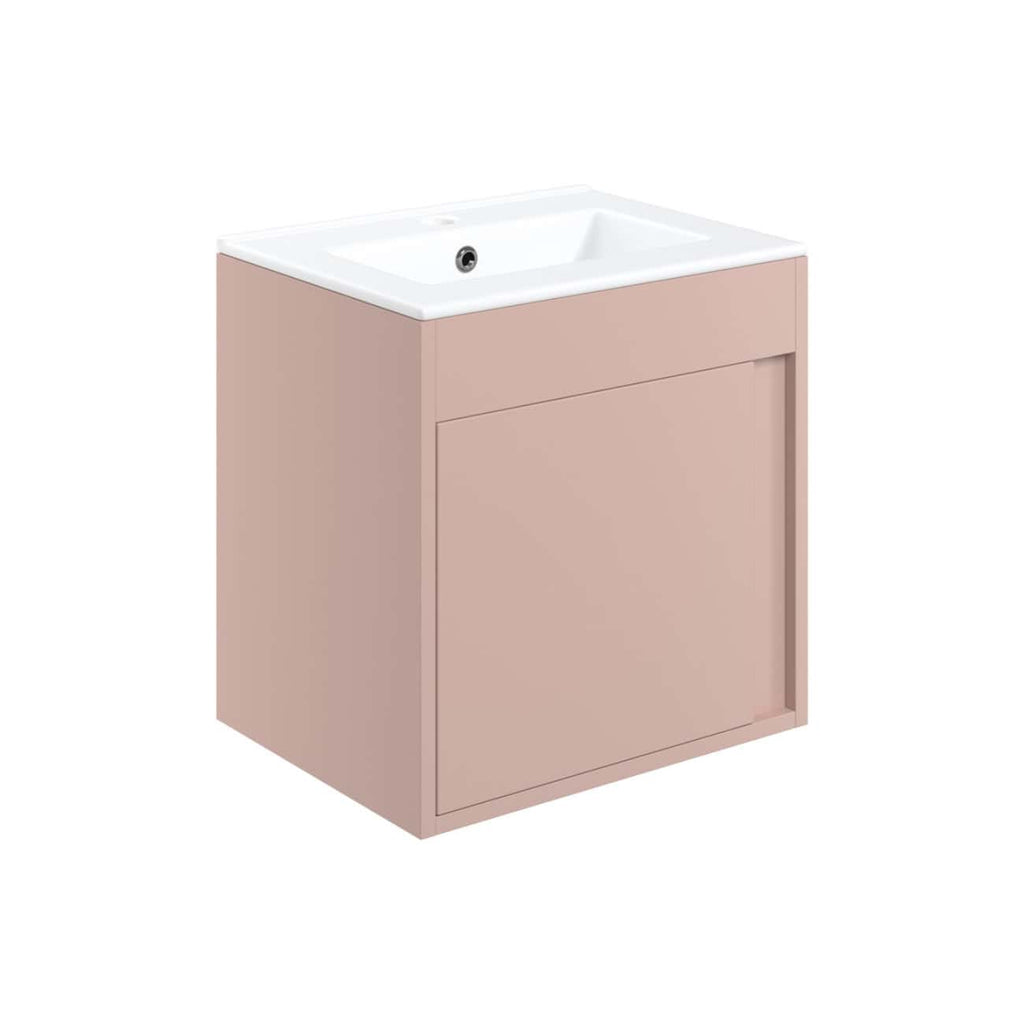 Modern blush pink bathroom vanity with integrated ceramic sink, minimalist design, ideal for contemporary bathrooms, featuring clean lines and ample storage space.