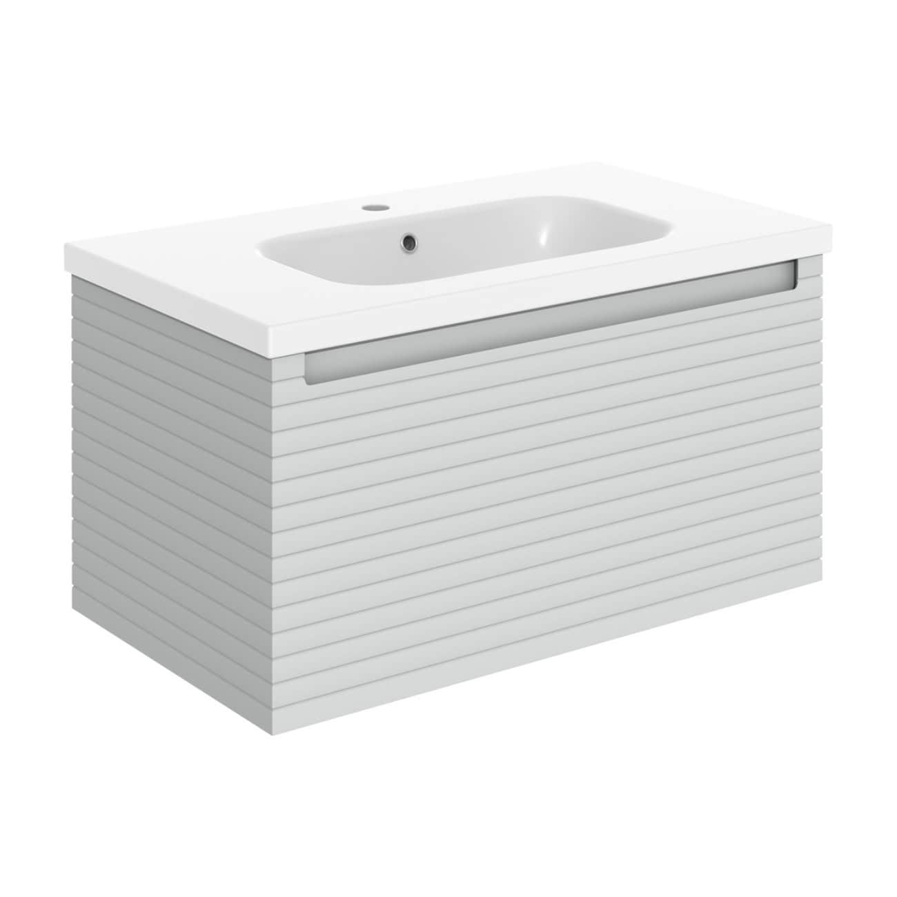Minimalist white bathroom vanity with slatted front design and integrated sink for modern bathrooms. Perfect for sleek, contemporary bathroom interiors.