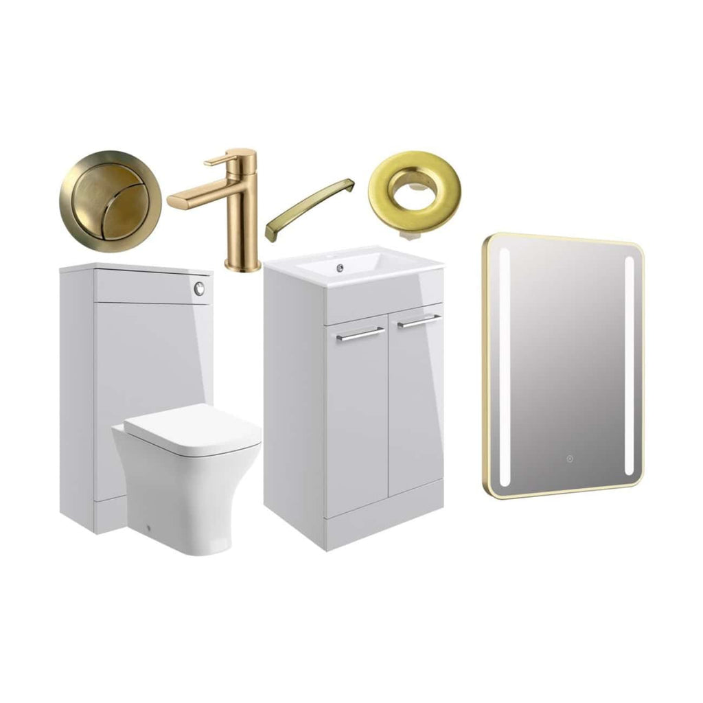 Modern bathroom fixtures including a white toilet, vanity with sink, stylish gold faucet, circular yellow wall accessories, and an illuminated mirror for contemporary bathroom design.