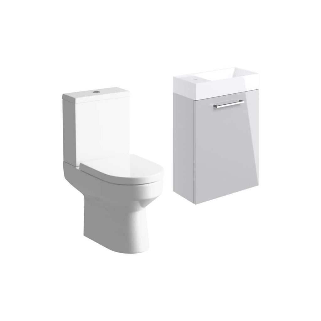 Sleek white toilet and bathroom vanity with sink, modern sanitaryware, minimalistic bathroom furniture, clean interior design, Bubly Bathrooms UK.